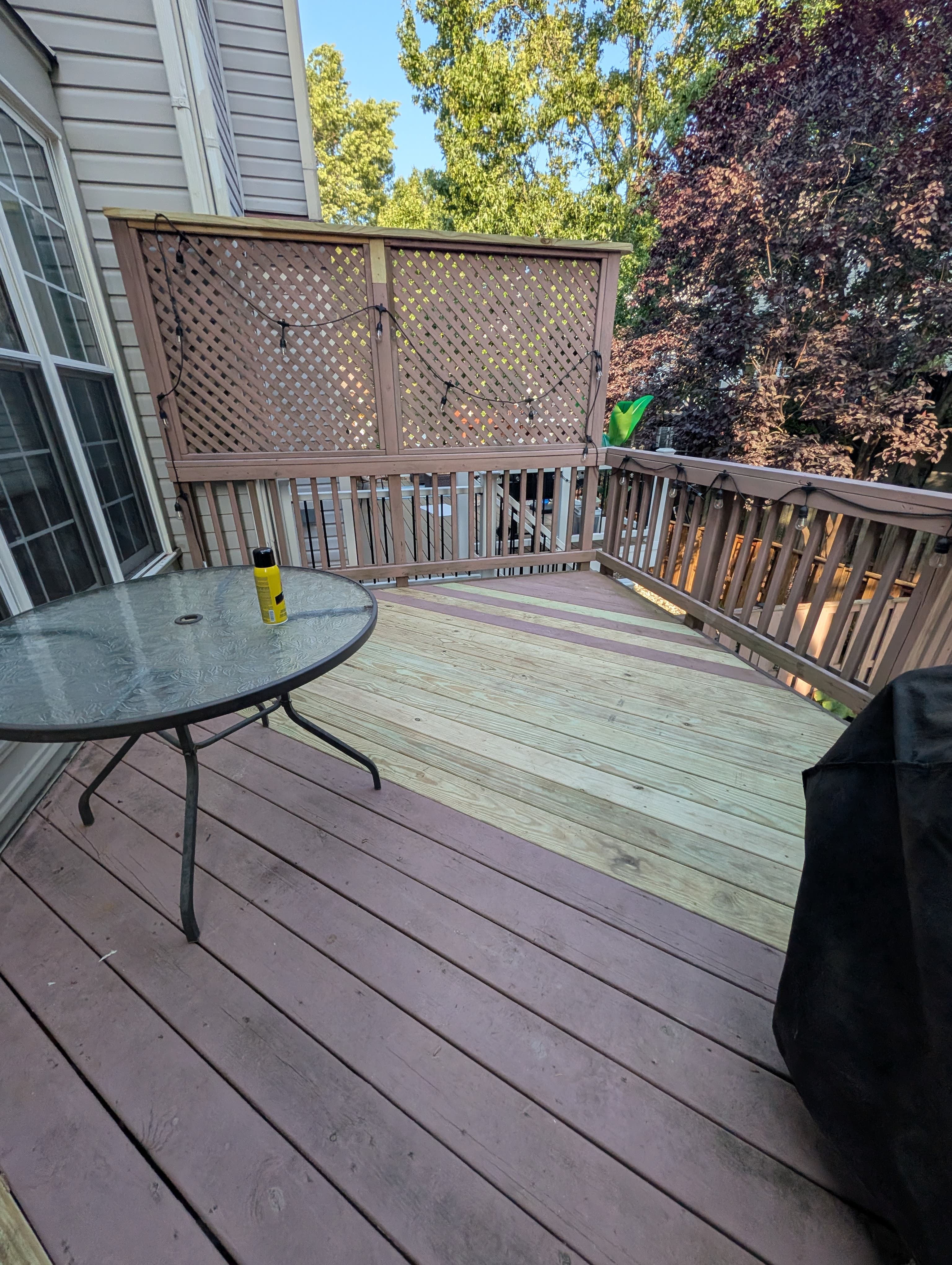 Deck with replaced boards during a repair and resurfacing project in Sterling