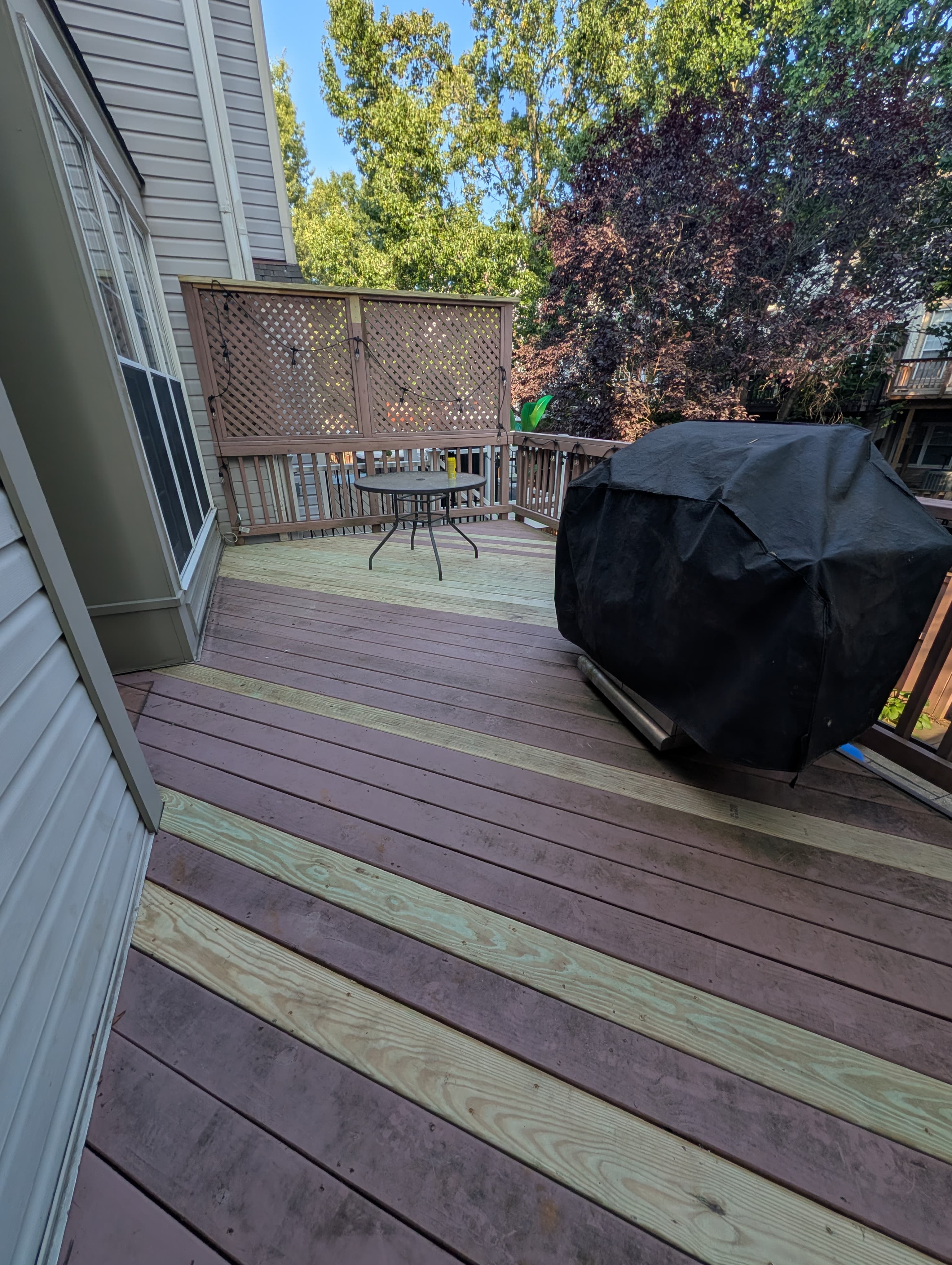 Wide view of the resurfaced deck with new boards in Sterling